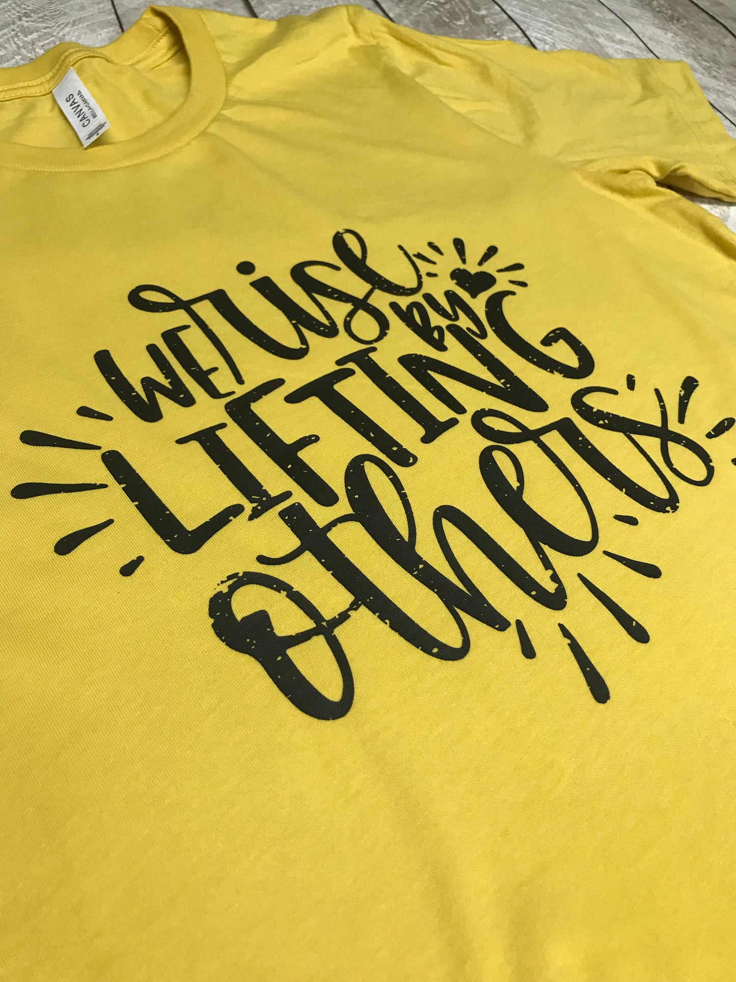 We Rise by Lifting Others Screenprint Tee