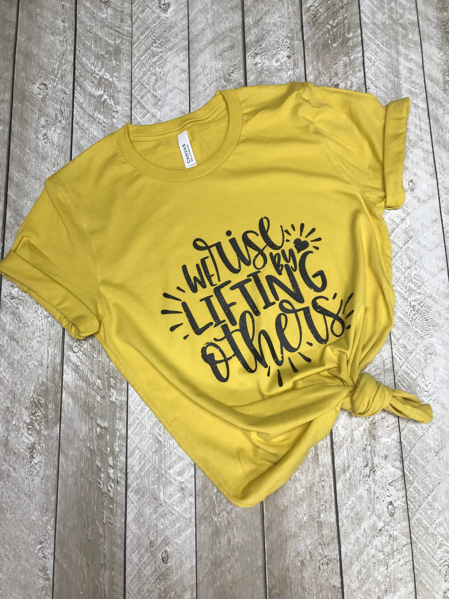 We Rise by Lifting Others Screenprint Tee